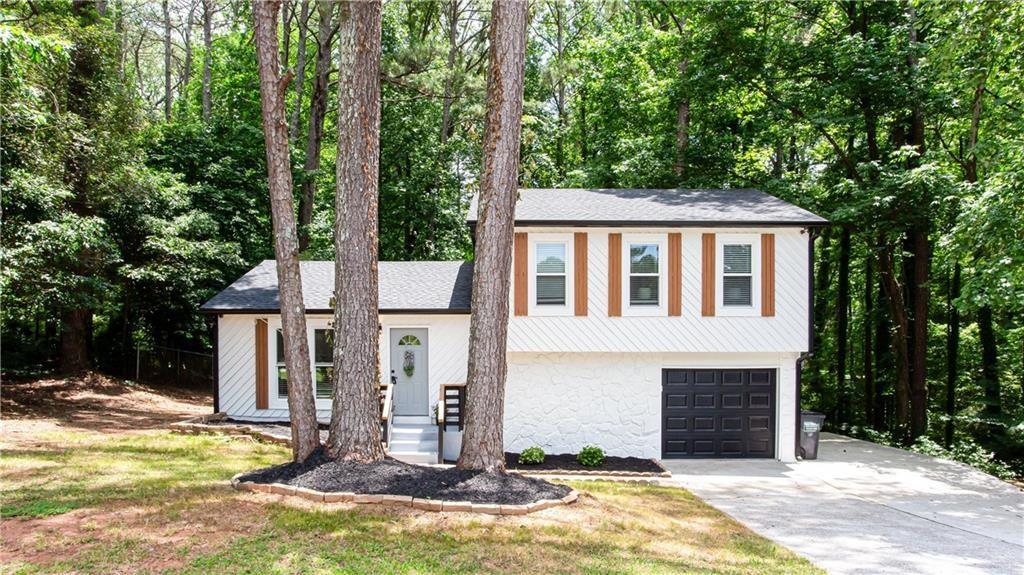 3038 Sutter Court Southwest Snellville, GA 30039 - Photo 22 of 22 a view of house with outdoor space and swimming pool