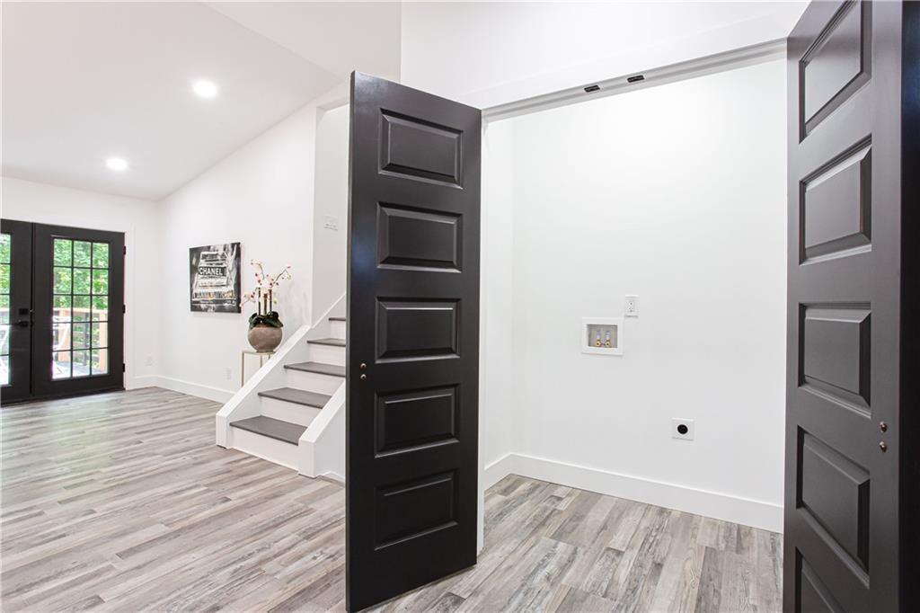 3038 Sutter Court Southwest Snellville, GA 30039 - Photo 6 of 22 a view of entryway with wooden floor and stairs