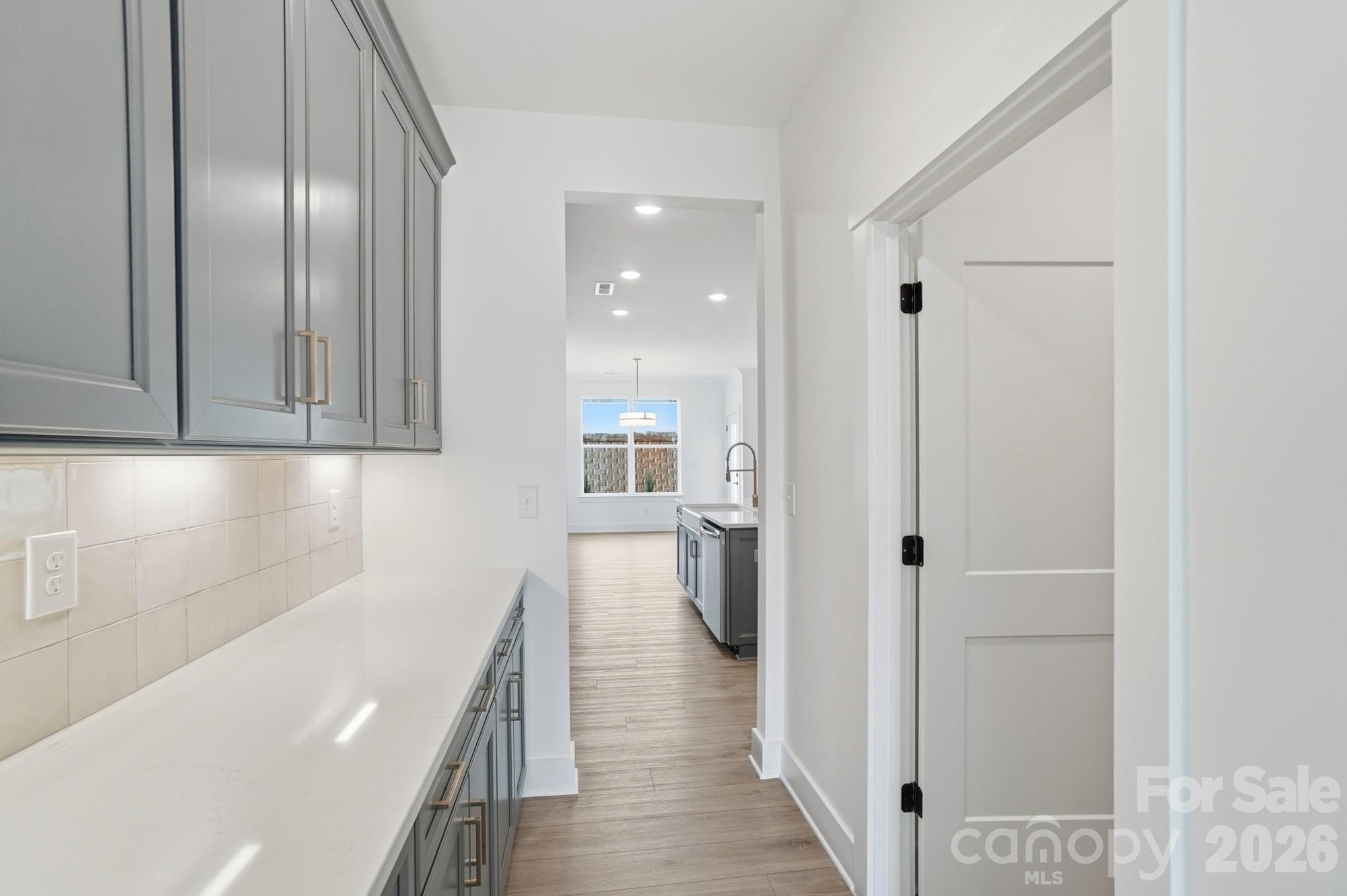 115 Longwood Road Mooresville, NC 28115 - Photo 11 of 43 a view of a hallway with wooden floor and staircase