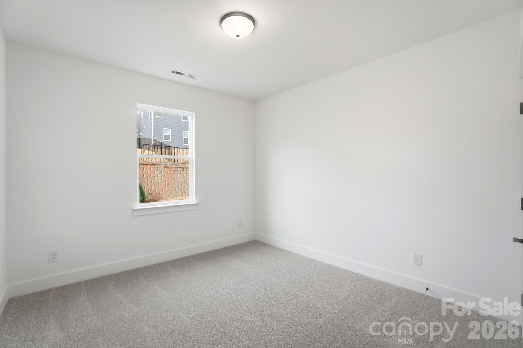 115 Longwood Road Mooresville, NC 28115 - Photo 20 of 43 an empty room with a window