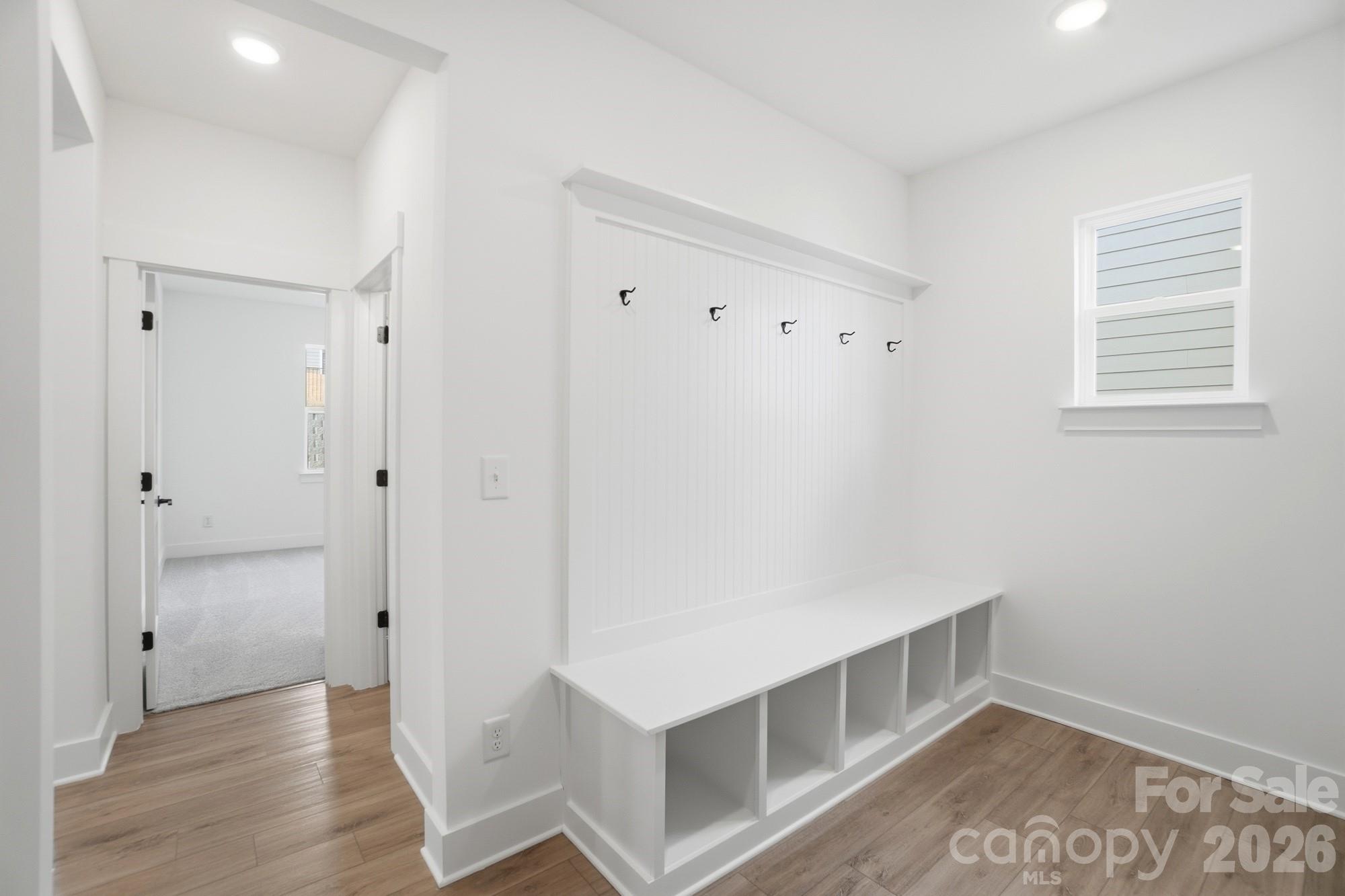 115 Longwood Road Mooresville, NC 28115 - Photo 23 of 43 a view of an empty room with wooden floor