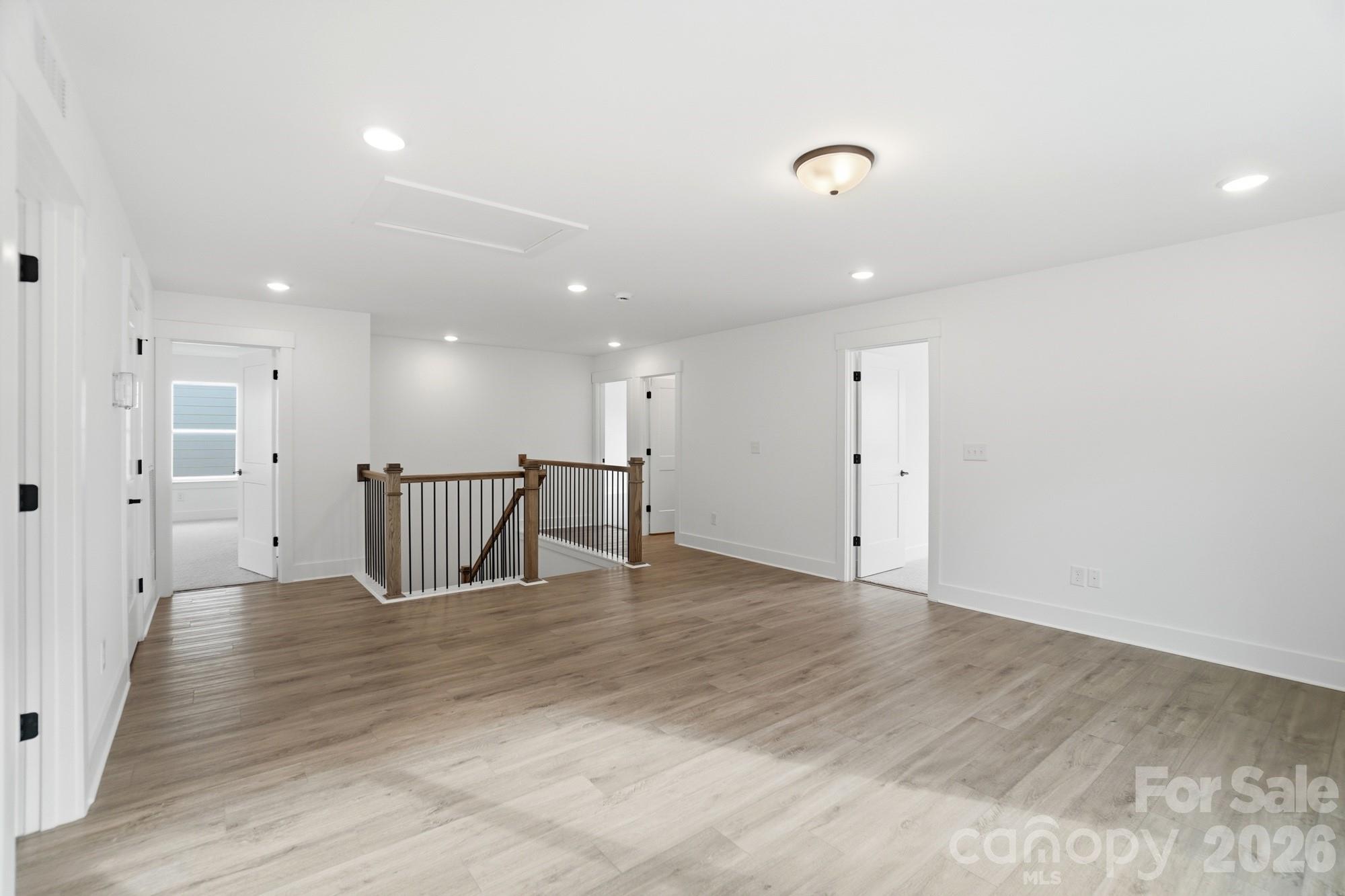 115 Longwood Road Mooresville, NC 28115 - Photo 26 of 43 a view of an empty room with wooden floor