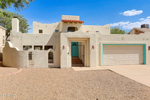 a vase of flowers sitting on a wooden floor