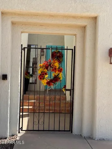 a view of an empty room with a fan