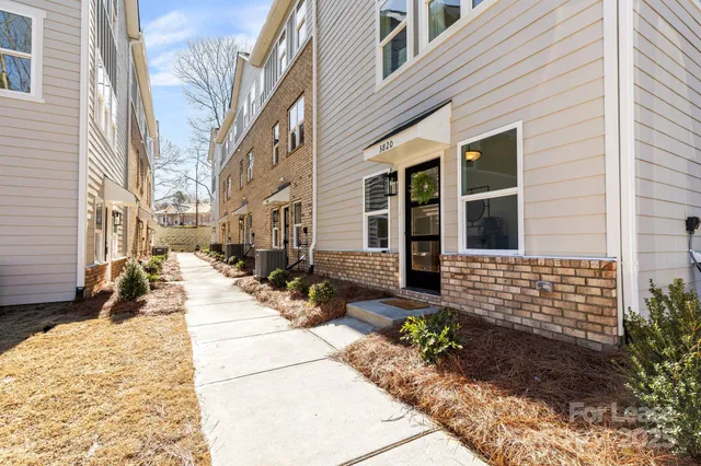 a view of a building with sitting area