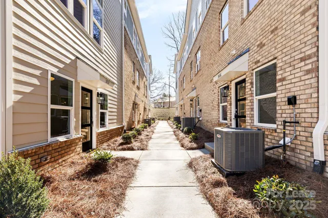 a view of a patio with table and chairs and potted plants