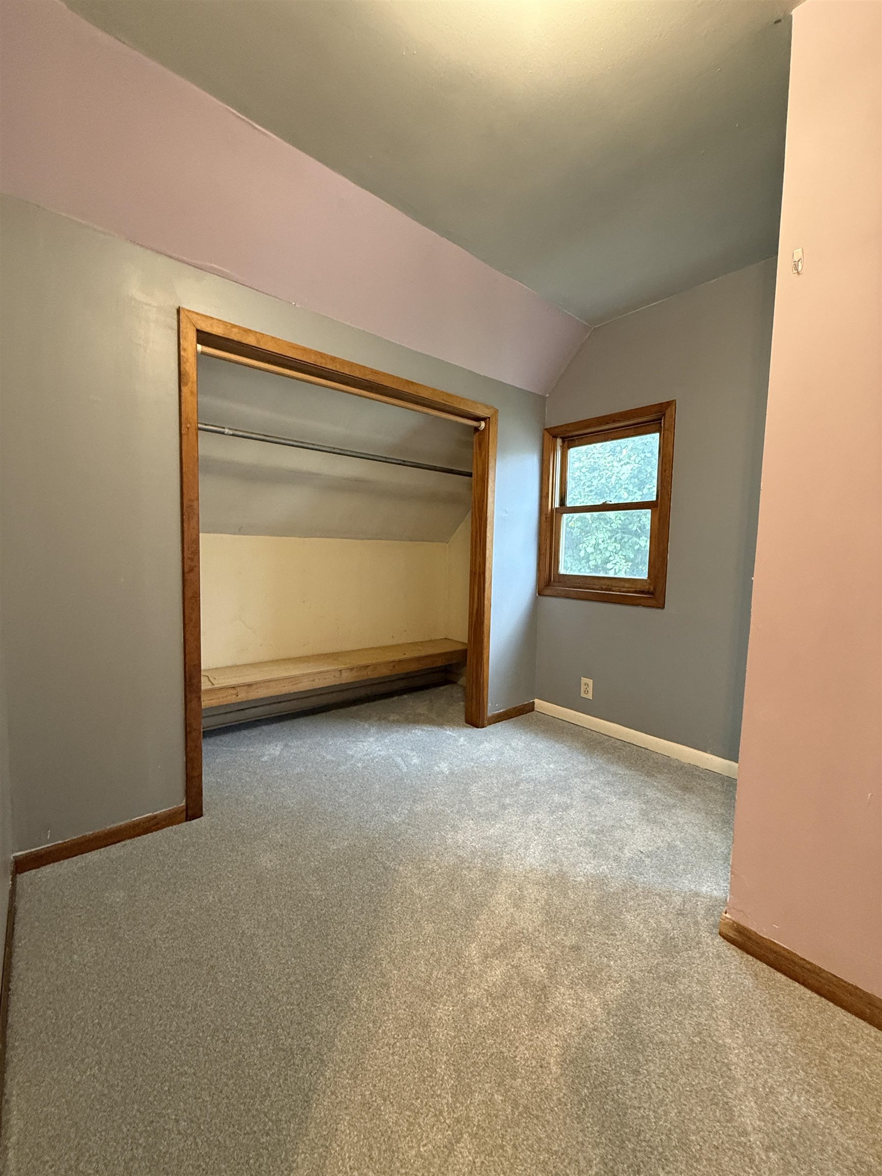 809 16th Street North Virginia, MN 55792 - Photo 28 of 44 Unfurnished bedroom with vaulted ceiling and carpet
