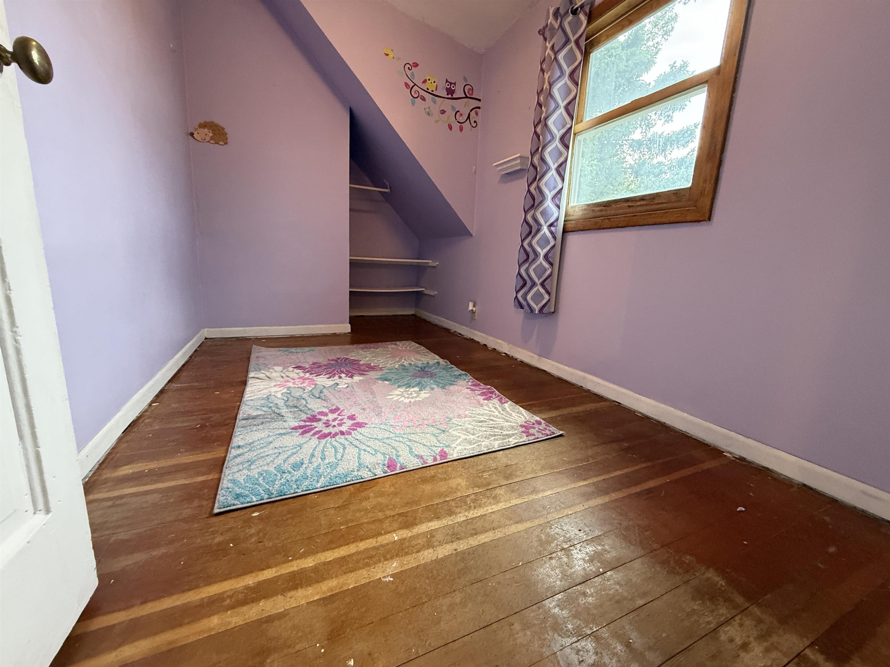 809 16th Street North Virginia, MN 55792 - Photo 34 of 44 Bonus room with wood-type flooring and baseboards