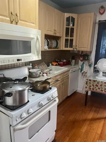 a kitchen with a stove and a microwave
