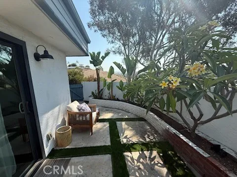 a view of balcony with furniture