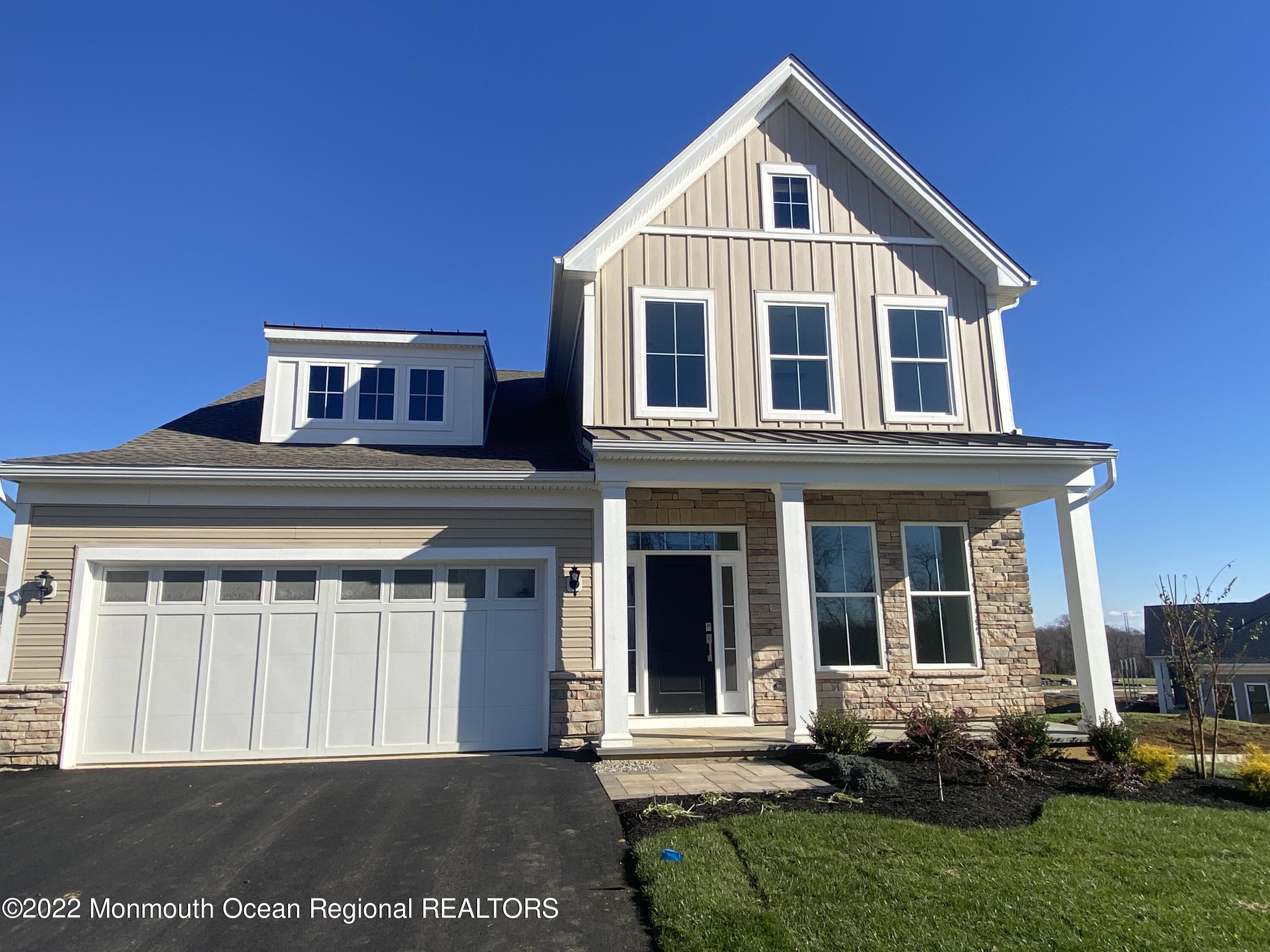 60 Sofia Drive Manalapan, NJ 07726 - Photo 3 of 18 a front view of a house with a yard