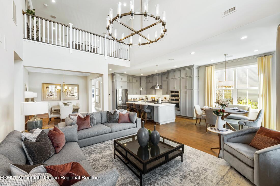 60 Sofia Drive Manalapan, NJ 07726 - Photo 7 of 18 a living room with furniture fireplace and a large window