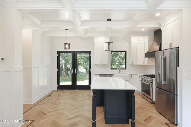 a kitchen with a refrigerator and a sink