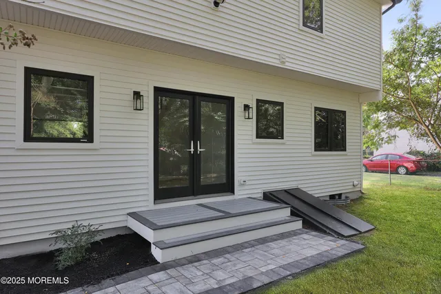 a view of a two chairs in the backyard