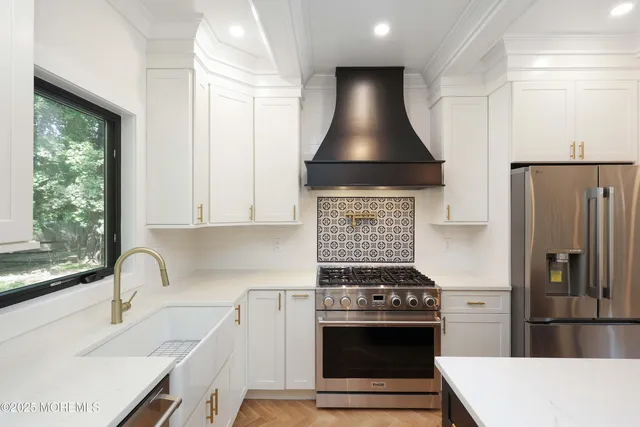 a kitchen with a stove and a refrigerator