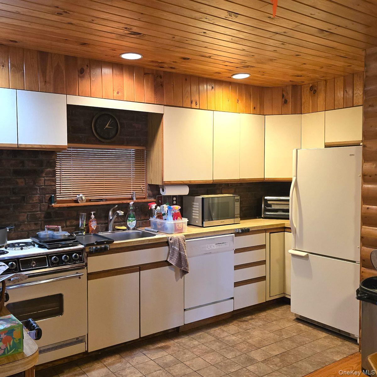 14 Lena Road Monticello, NY 12777 - Photo 13 of 22 a kitchen with stainless steel appliances a refrigerator and a stove