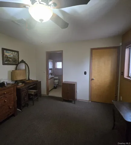 a bedroom with bed and window