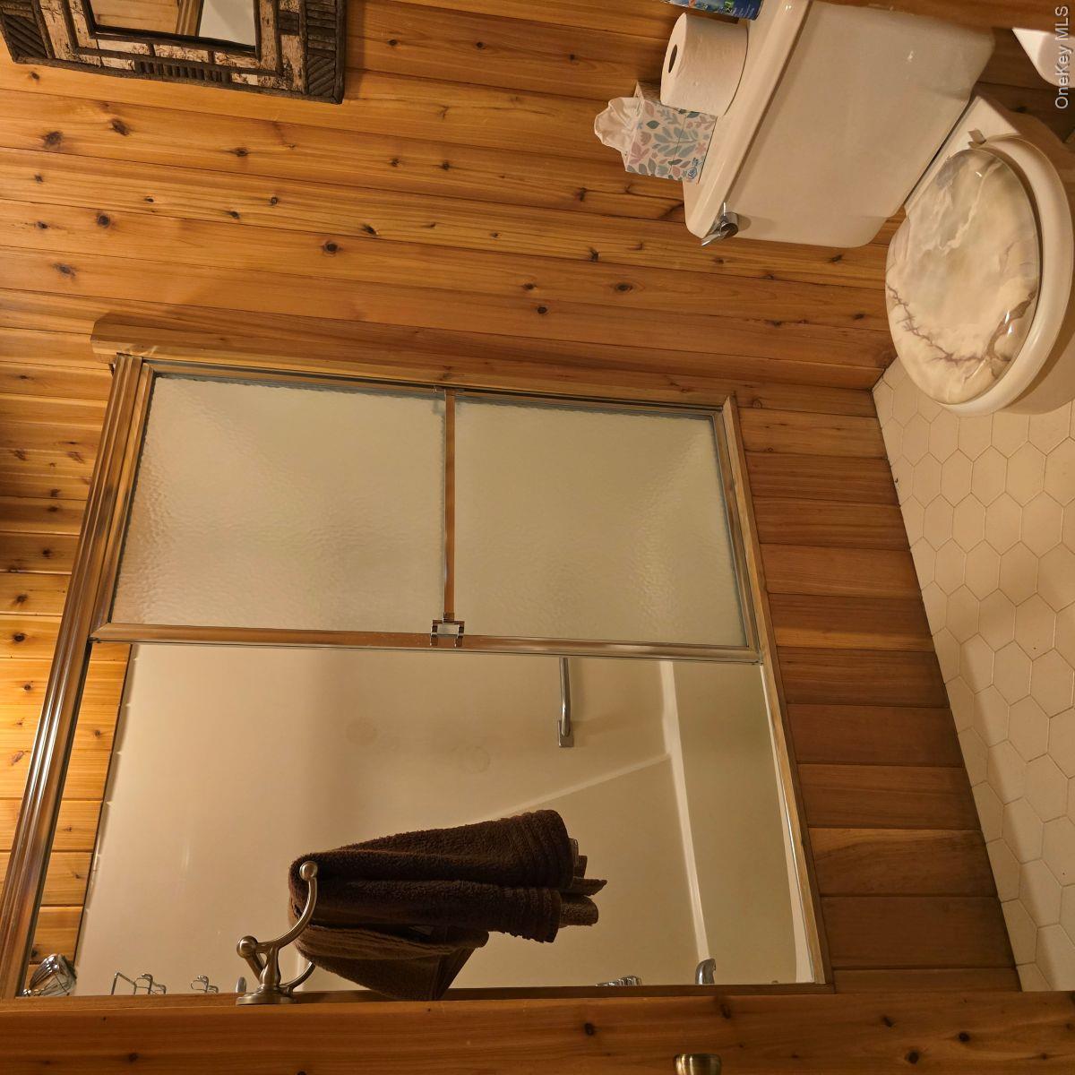 14 Lena Road Monticello, NY 12777 - Photo 19 of 22 a bathroom with a toilet and a shower