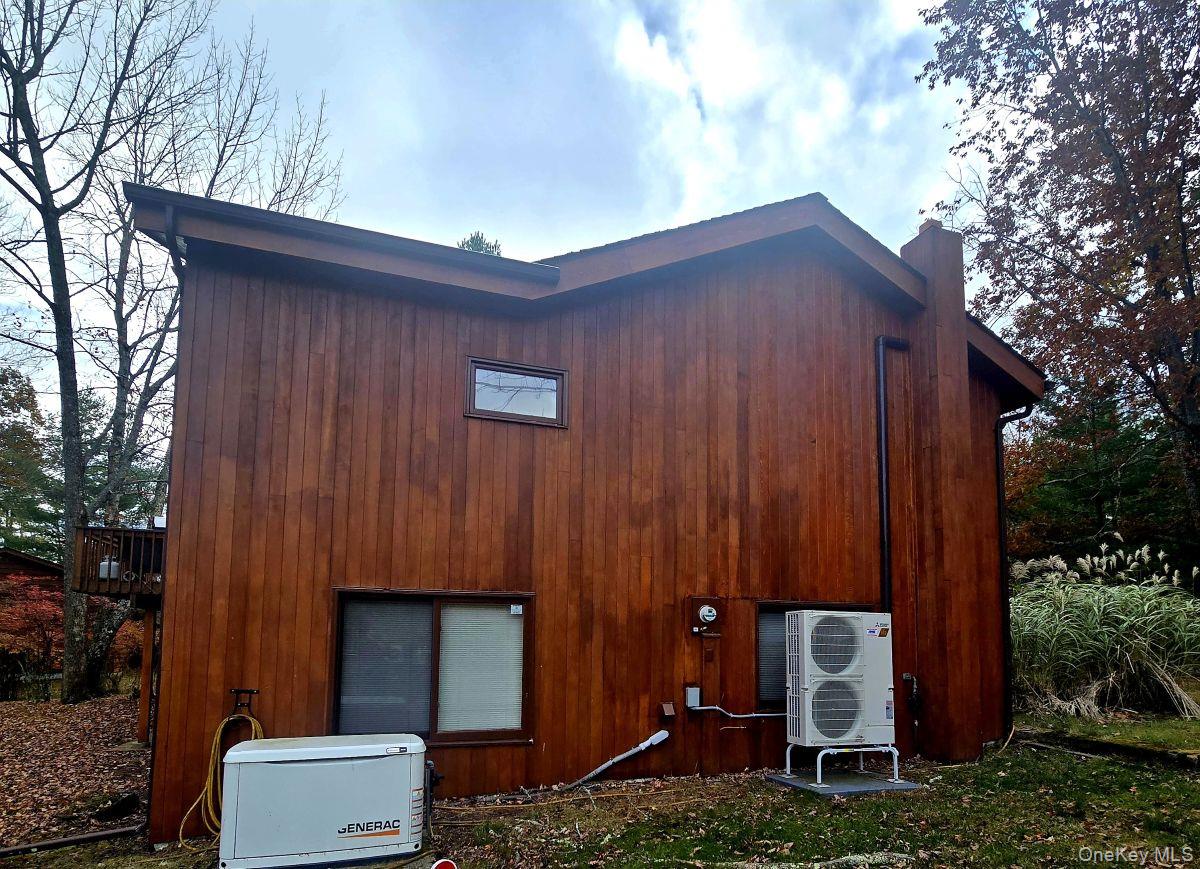 14 Lena Road Monticello, NY 12777 - Photo 5 of 22 a backyard view with hardwood wall and trees