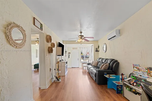 a living room with furniture fireplace and a chandelier