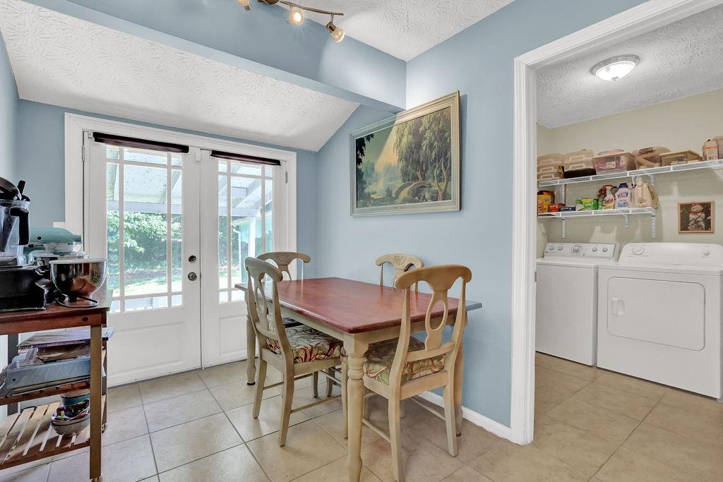1555 Rock Springs Road Buford, GA 30519 - Photo 6 of 27 a dining room with furniture and window