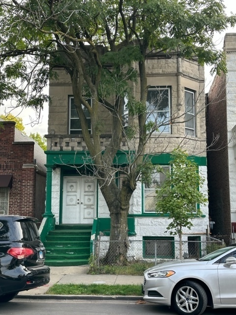 a front view of a house with parking