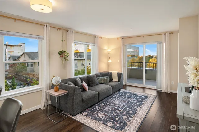 a living room with furniture and a rug