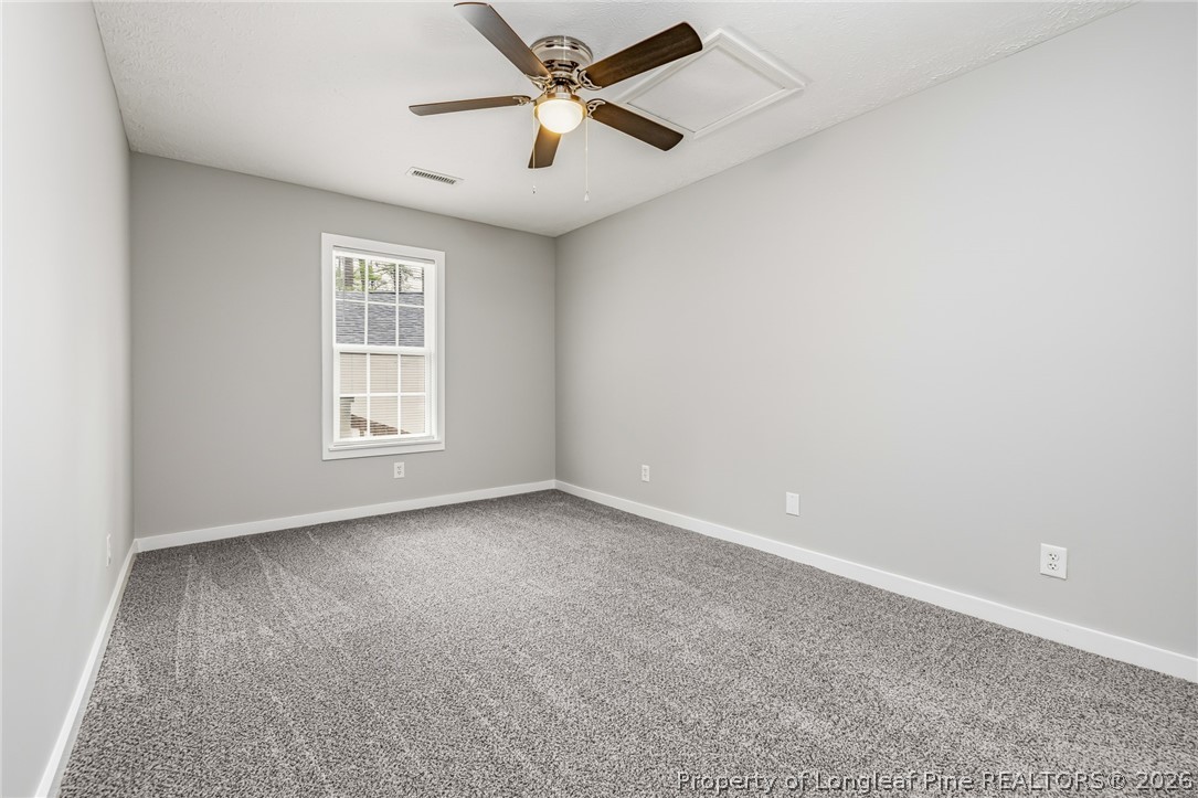 3524 Pine Log Road Lumberton, NC 28360 - Photo 19 of 42 an empty room with windows and fan