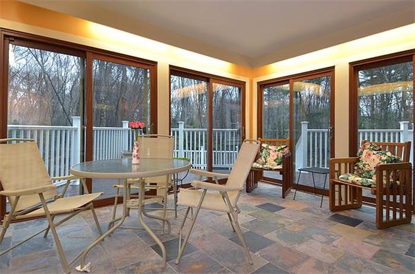 36 Gunnison Road Boxford, MA 01921 - Photo 14 of 24 a view of a patio with a dining table and chairs