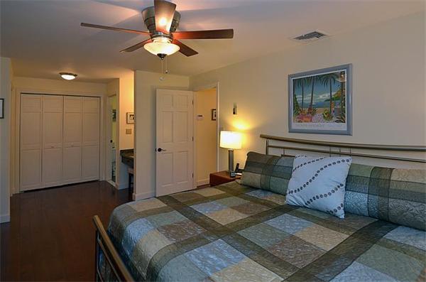 36 Gunnison Road Boxford, MA 01921 - Photo 15 of 24 a bedroom with a bed and a chandelier