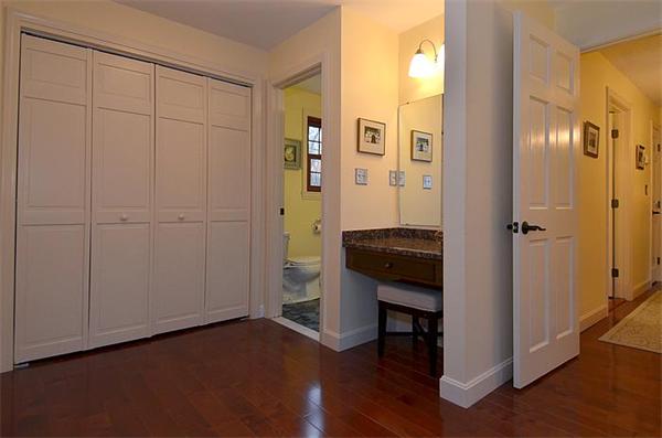 36 Gunnison Road Boxford, MA 01921 - Photo 17 of 24 a view of a hallway with wooden floor and closet area
