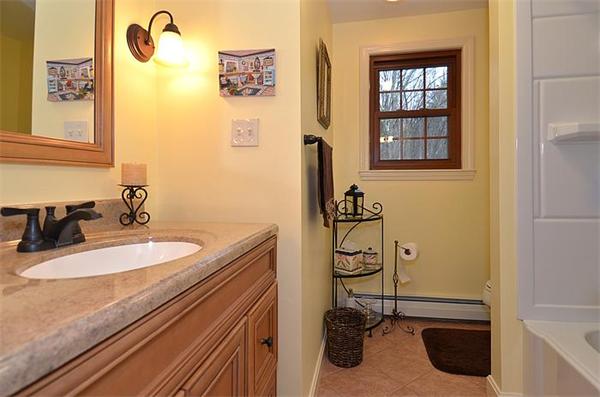 36 Gunnison Road Boxford, MA 01921 - Photo 22 of 24 a bathroom with a sink and a mirror
