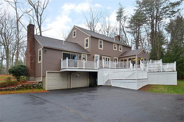 36 Gunnison Road Boxford, MA 01921 - Photo 3 of 24 a front view of a house with garage