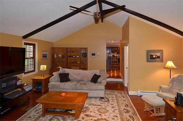36 Gunnison Road Boxford, MA 01921 - Photo 10 of 24 a living room with furniture and a flat screen tv