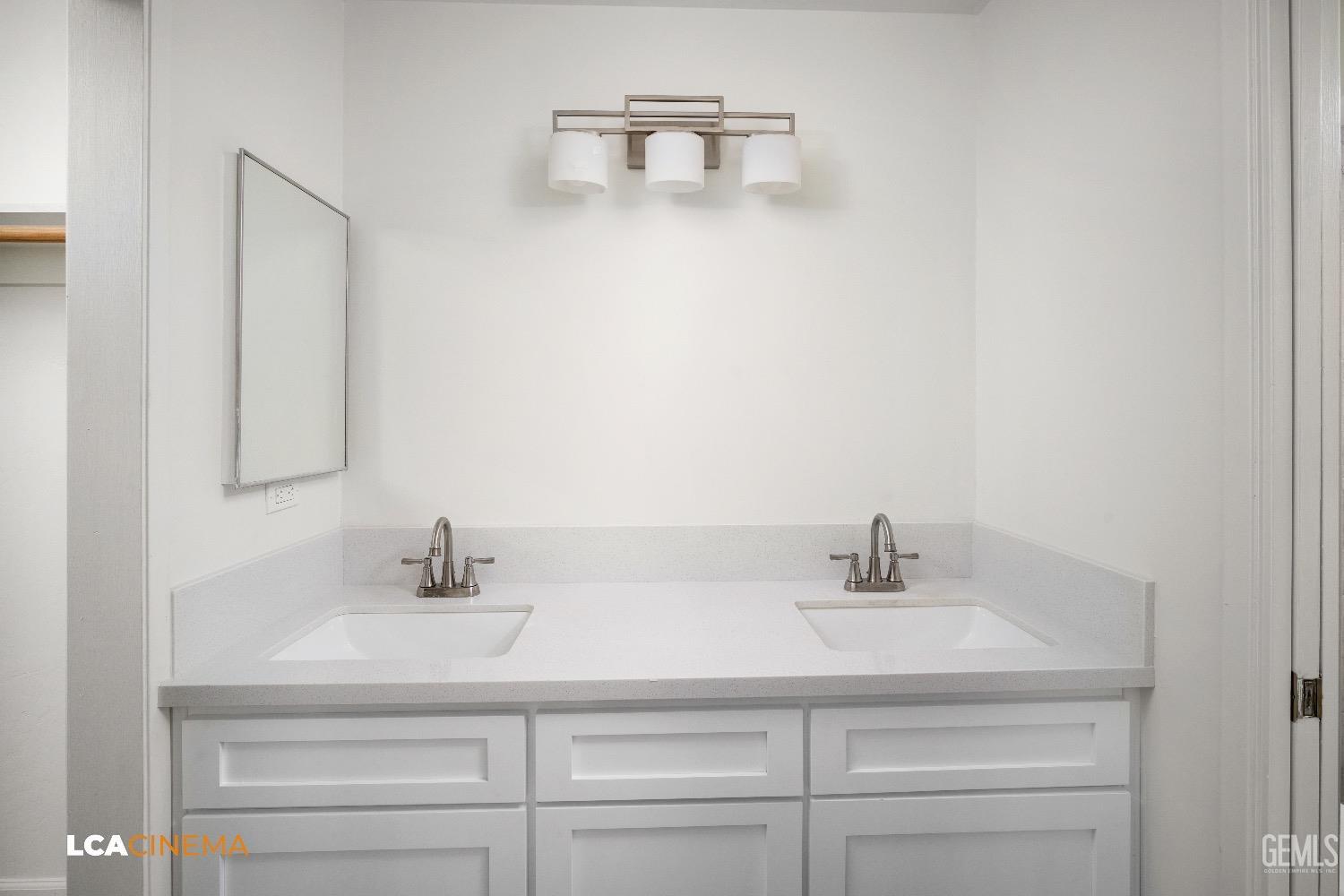 Undisclosed Address Bakersfield, CA 93306 - Photo 14 of 24 a bathroom with a sink and a mirror