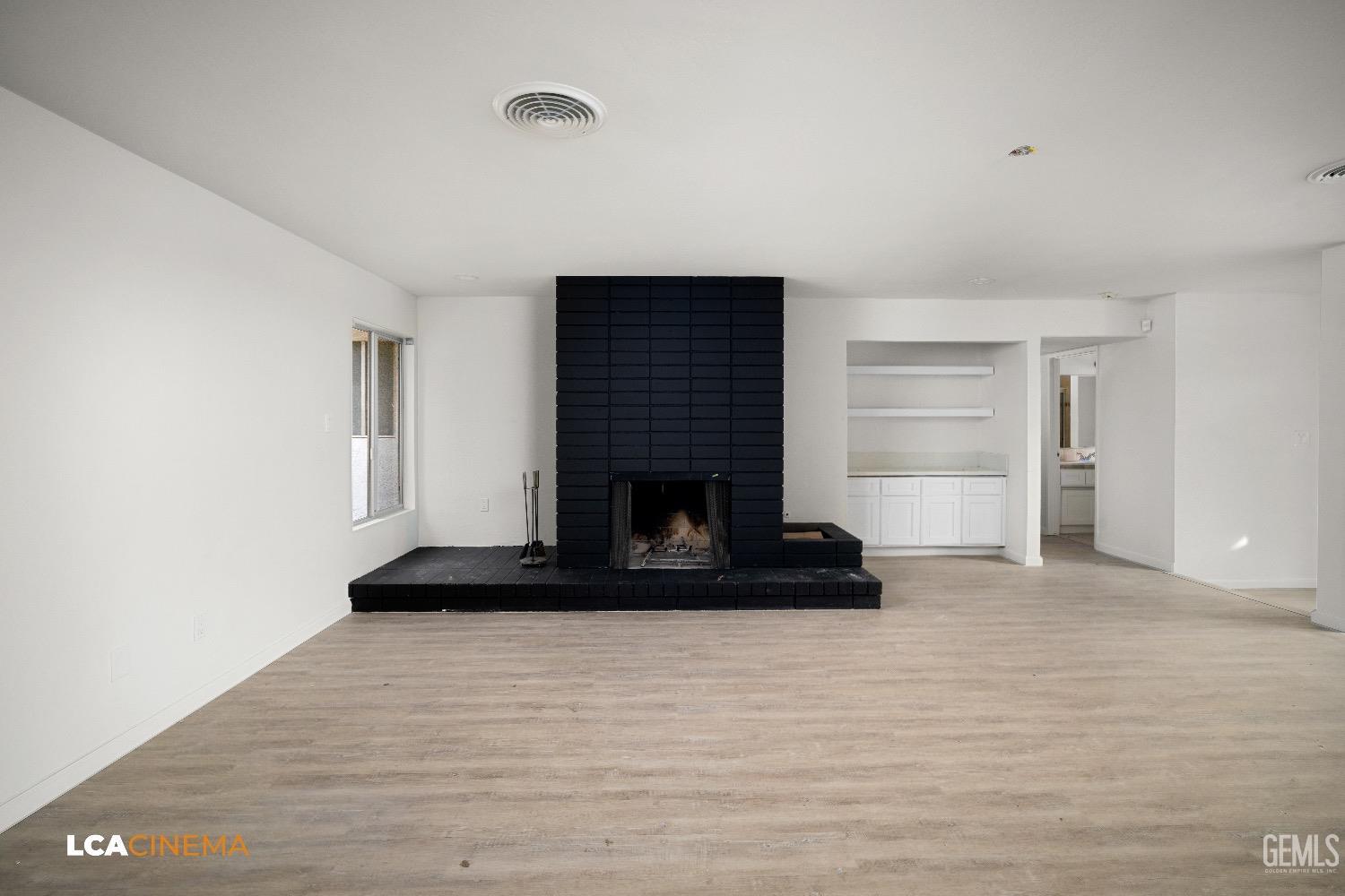 Undisclosed Address Bakersfield, CA 93306 - Photo 18 of 24 a living room with furniture and a fireplace