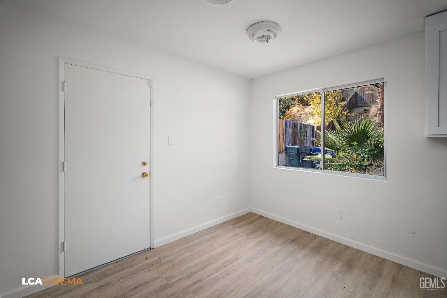 Undisclosed Address Bakersfield, CA 93306 - Photo 20 of 24 a view of empty room with wooden floor and fan
