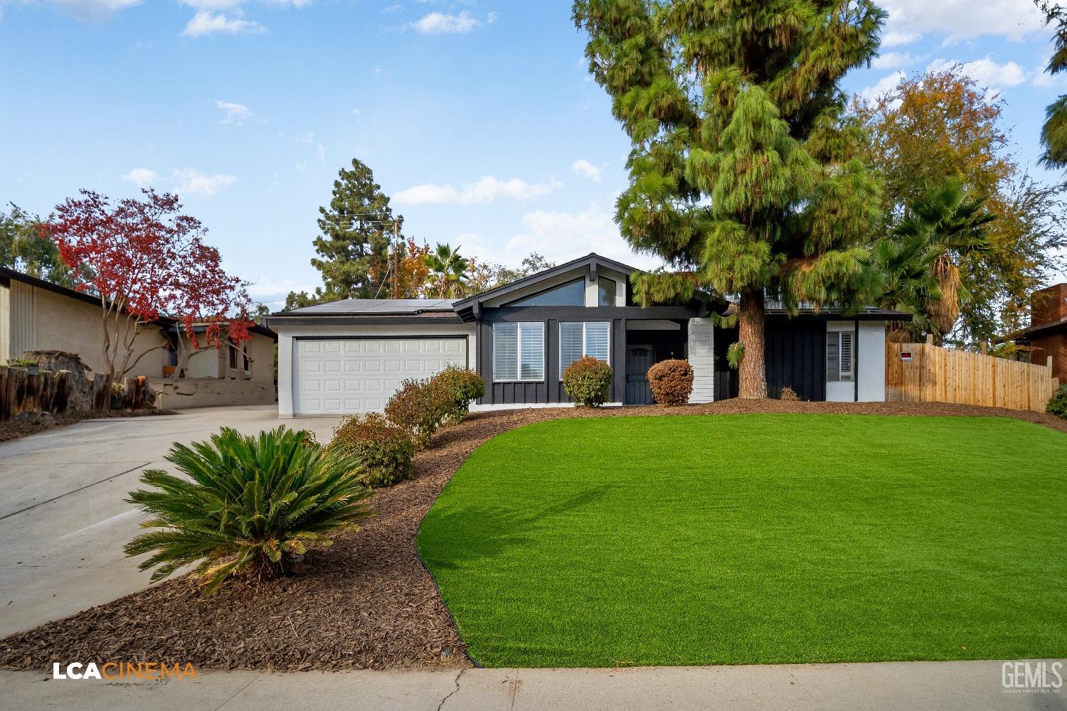 Undisclosed Address Bakersfield, CA 93306 - Photo 2 of 24 a view of a house with a yard