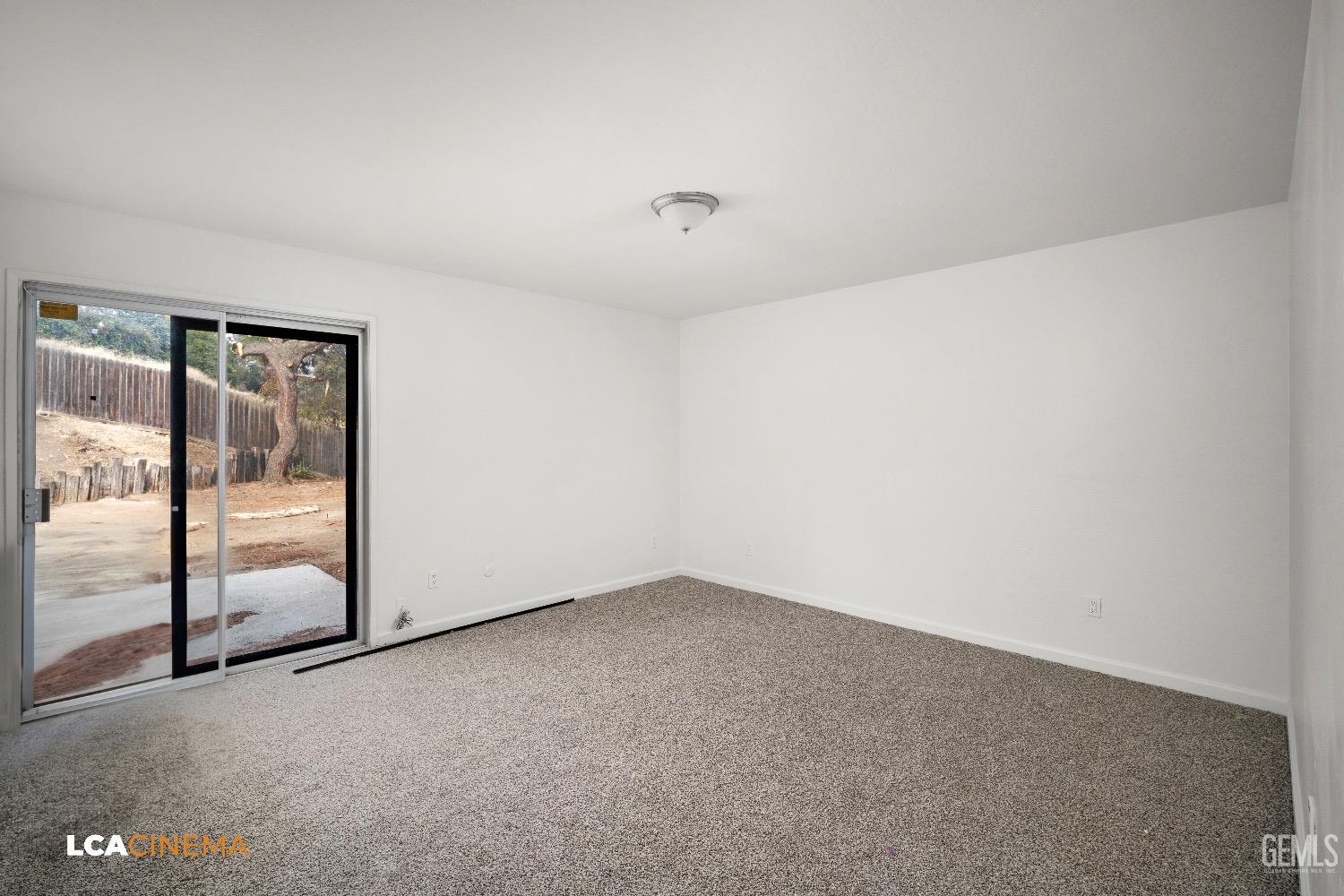 Undisclosed Address Bakersfield, CA 93306 - Photo 23 of 24 an empty room with sliding glass door