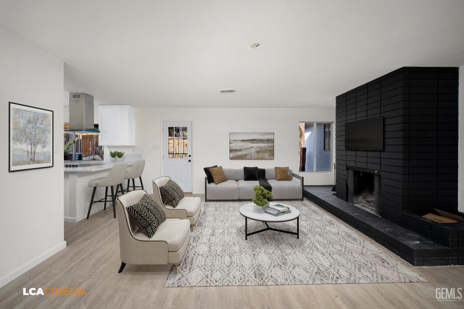 Undisclosed Address Bakersfield, CA 93306 - Photo 6 of 24 a living room with furniture and a fireplace