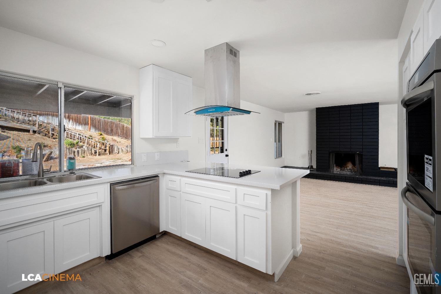 Undisclosed Address Bakersfield, CA 93306 - Photo 7 of 24 a kitchen with a sink and cabinets