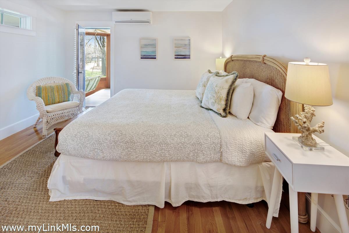 72 Chappaquiddick Avenue Edgartown, MA 02539 - Photo 20 of 63 a bedroom with a bed and window