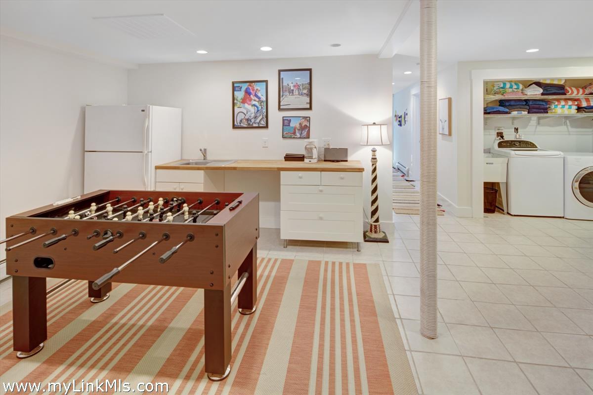72 Chappaquiddick Avenue Edgartown, MA 02539 - Photo 33 of 63 Primary home lower level laundry, casual play area