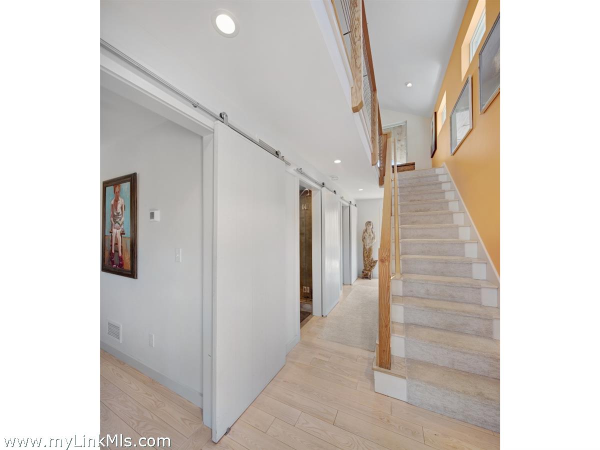 72 Chappaquiddick Avenue Edgartown, MA 02539 - Photo 44 of 63 a view of a hallway with staircase
