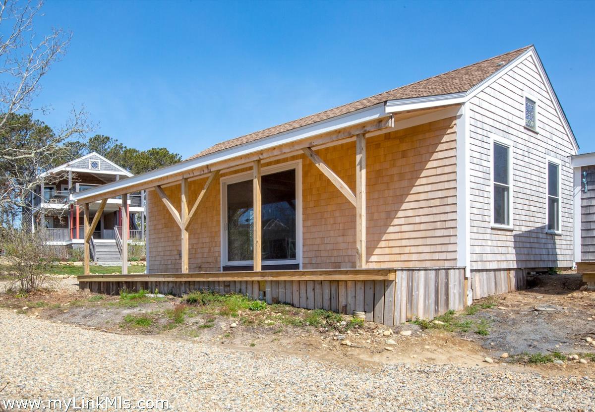 72 Chappaquiddick Avenue Edgartown, MA 02539 - Photo 52 of 63 a view of a house with a backyard