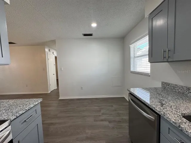 a view of hallway with livingroom