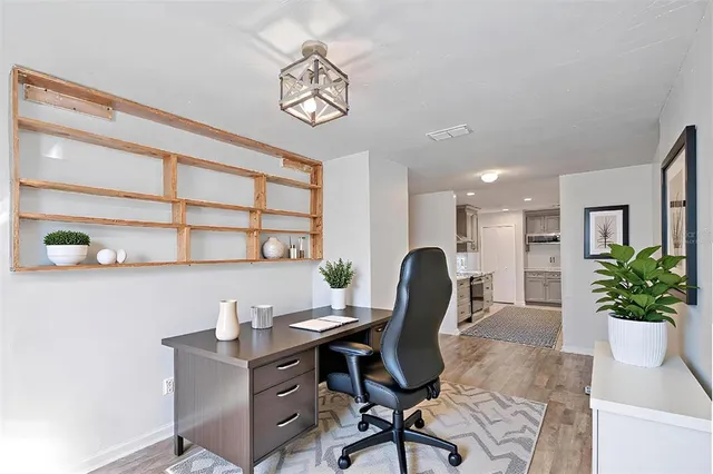 a view of a workspace with furniture