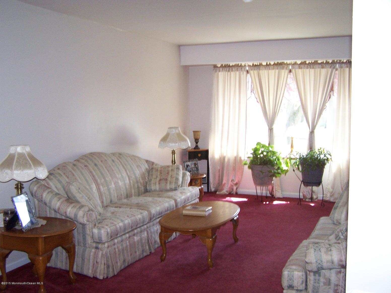 2 Blueberry Path Howell, NJ 07731 - Photo 3 of 7 a living room with furniture and a potted plant
