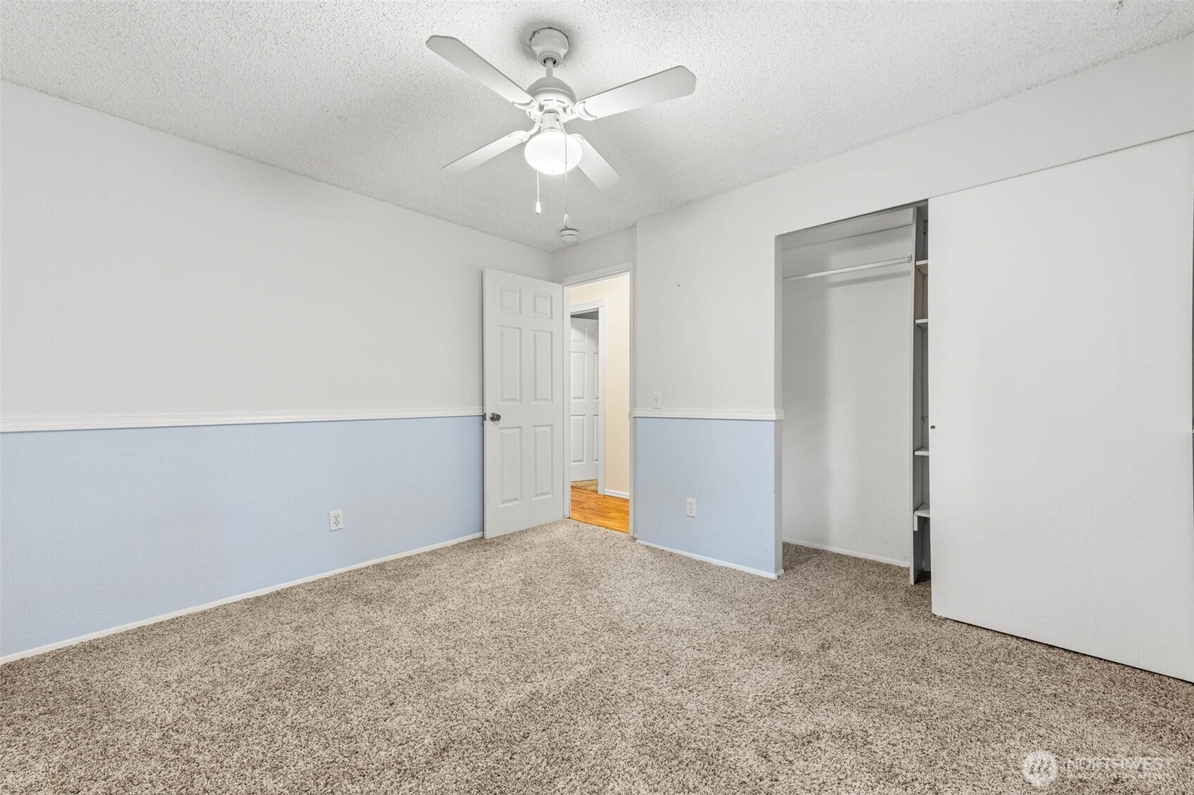 8529 37th Court Southeast Lacey, WA 98503 - Photo 23 of 34 an empty room with closet and fan