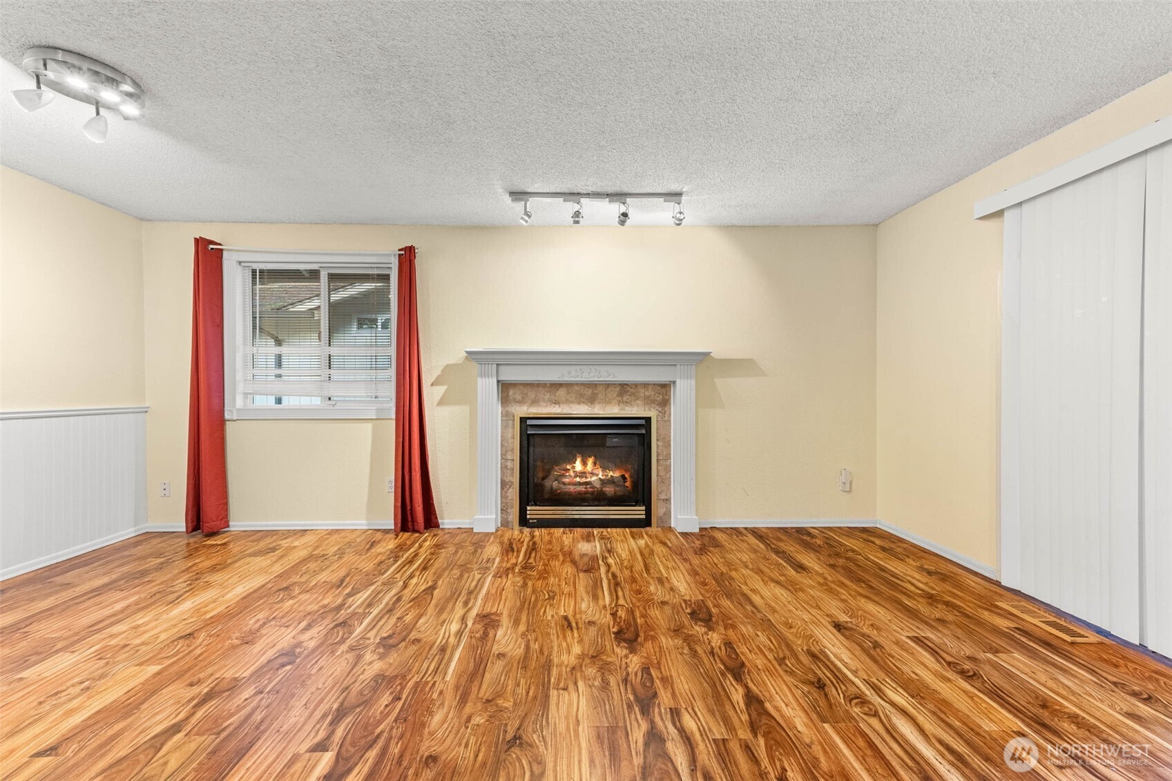 8529 37th Court Southeast Lacey, WA 98503 - Photo 7 of 34 a bedroom with a bed and a fireplace